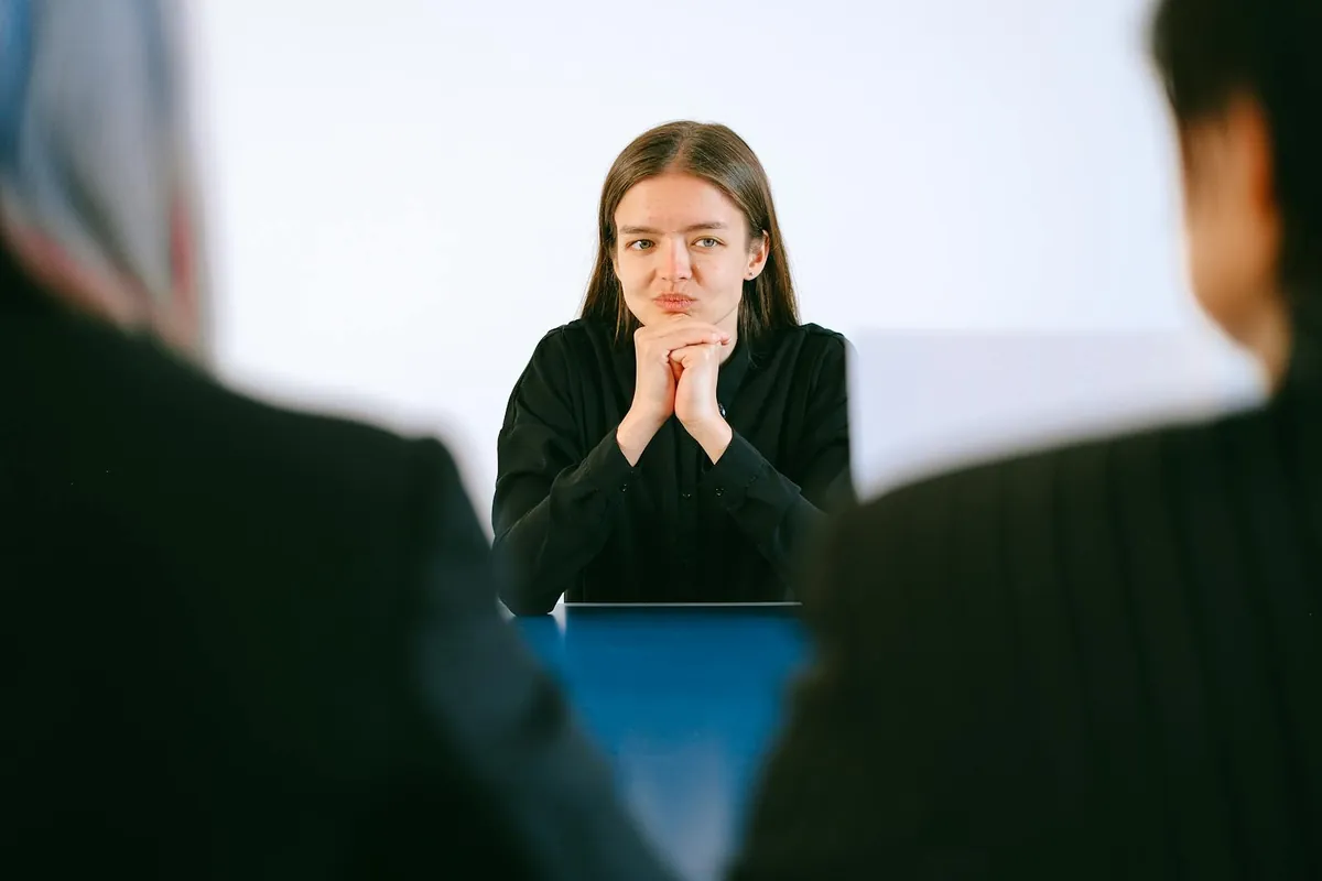 woman thinking during interview at office table