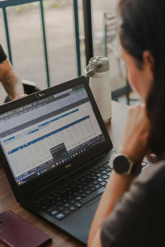laptop screen showing excel spreadsheet with charts