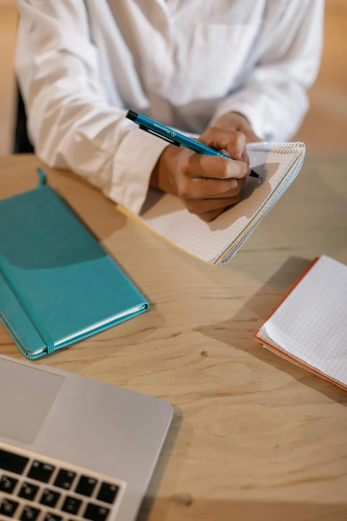person journaling notebook documenting workplace incidents