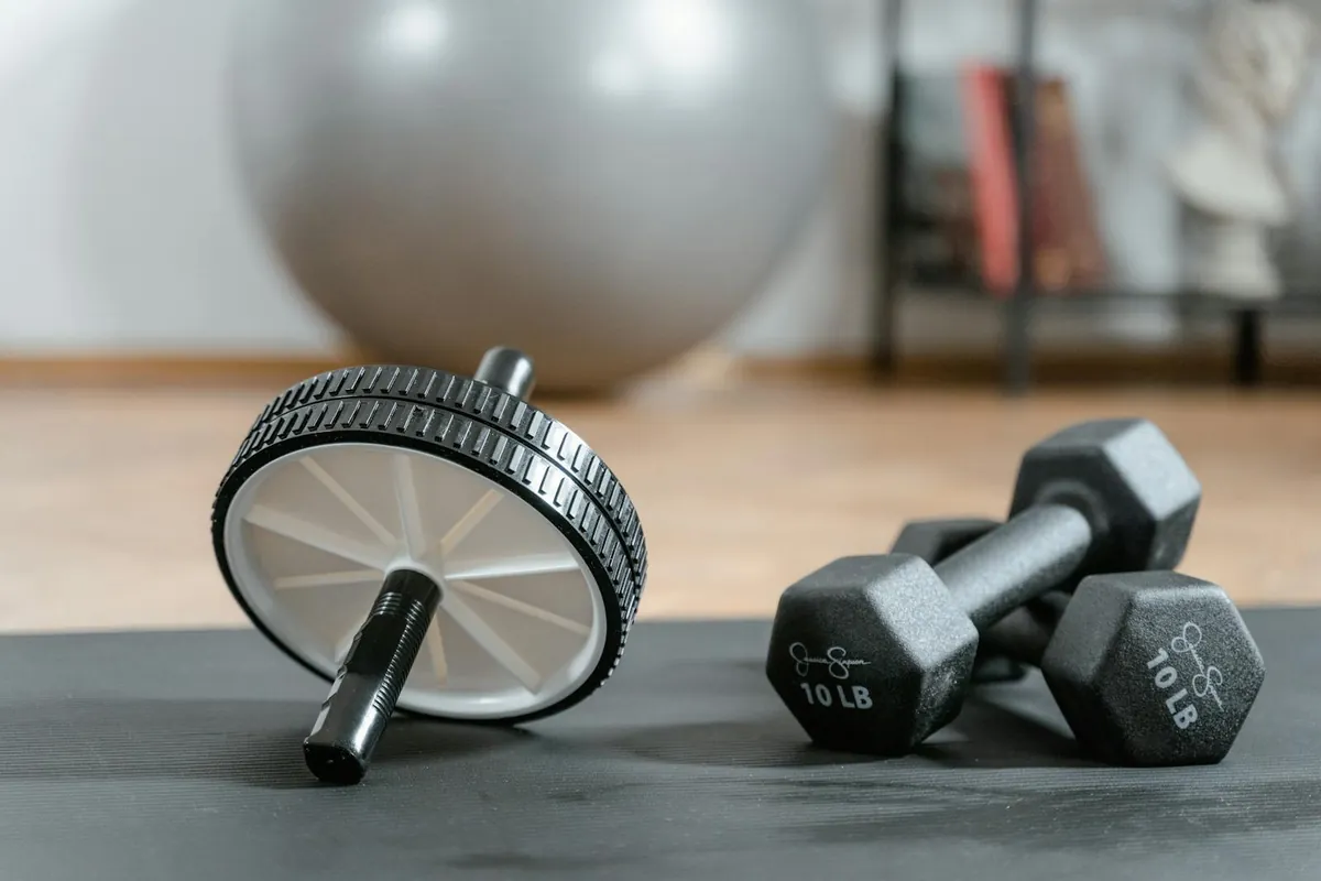 organised home gym equipment laid out next to door