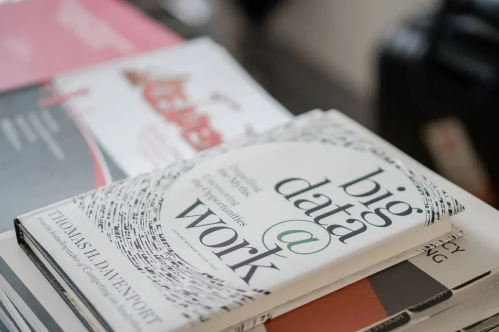 stack of career and business books on desk