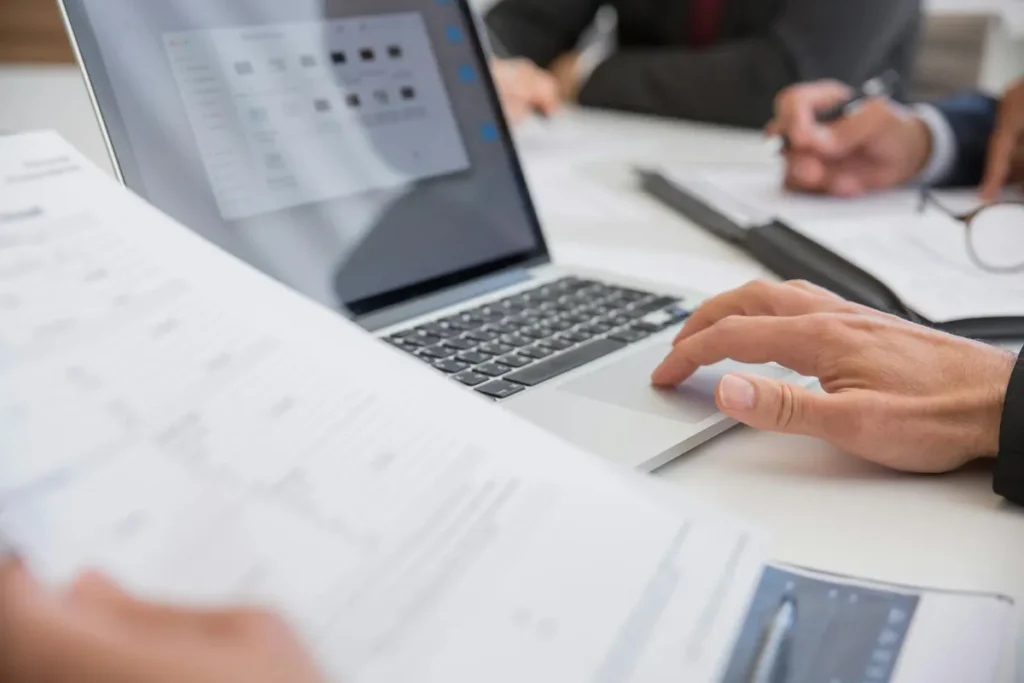 laptop with cover letter document open on screen