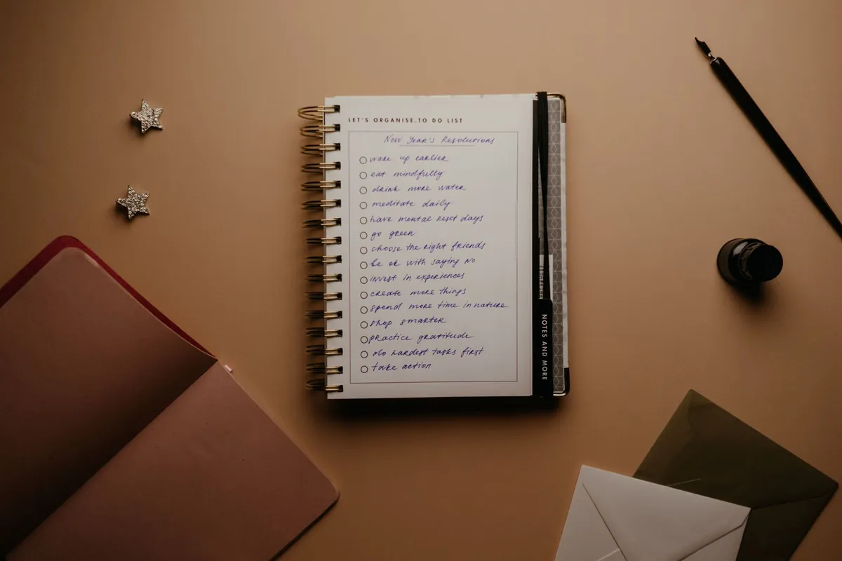 notebook with personal achievements log handwritten
