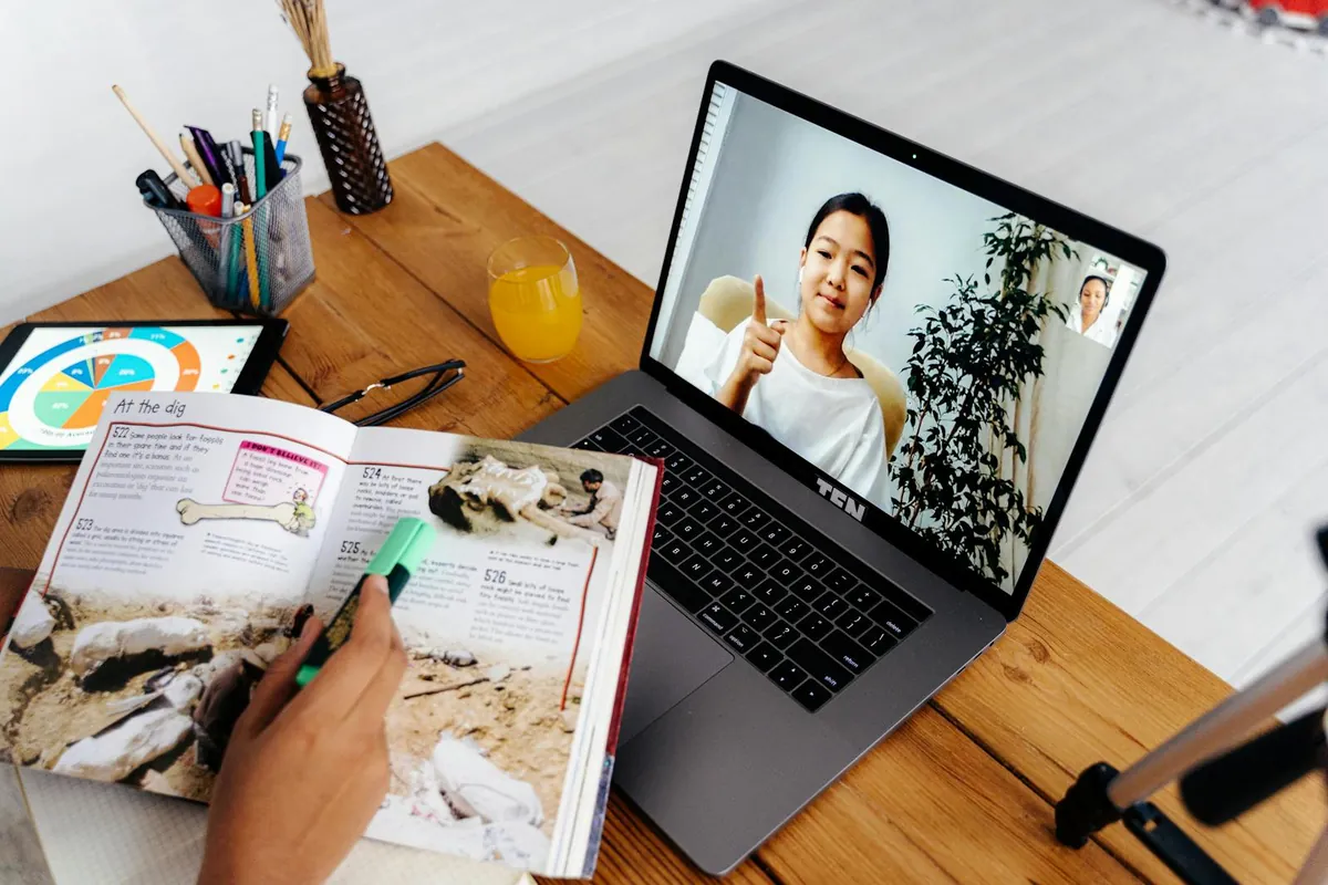 woman teaching online tutoring session on laptop