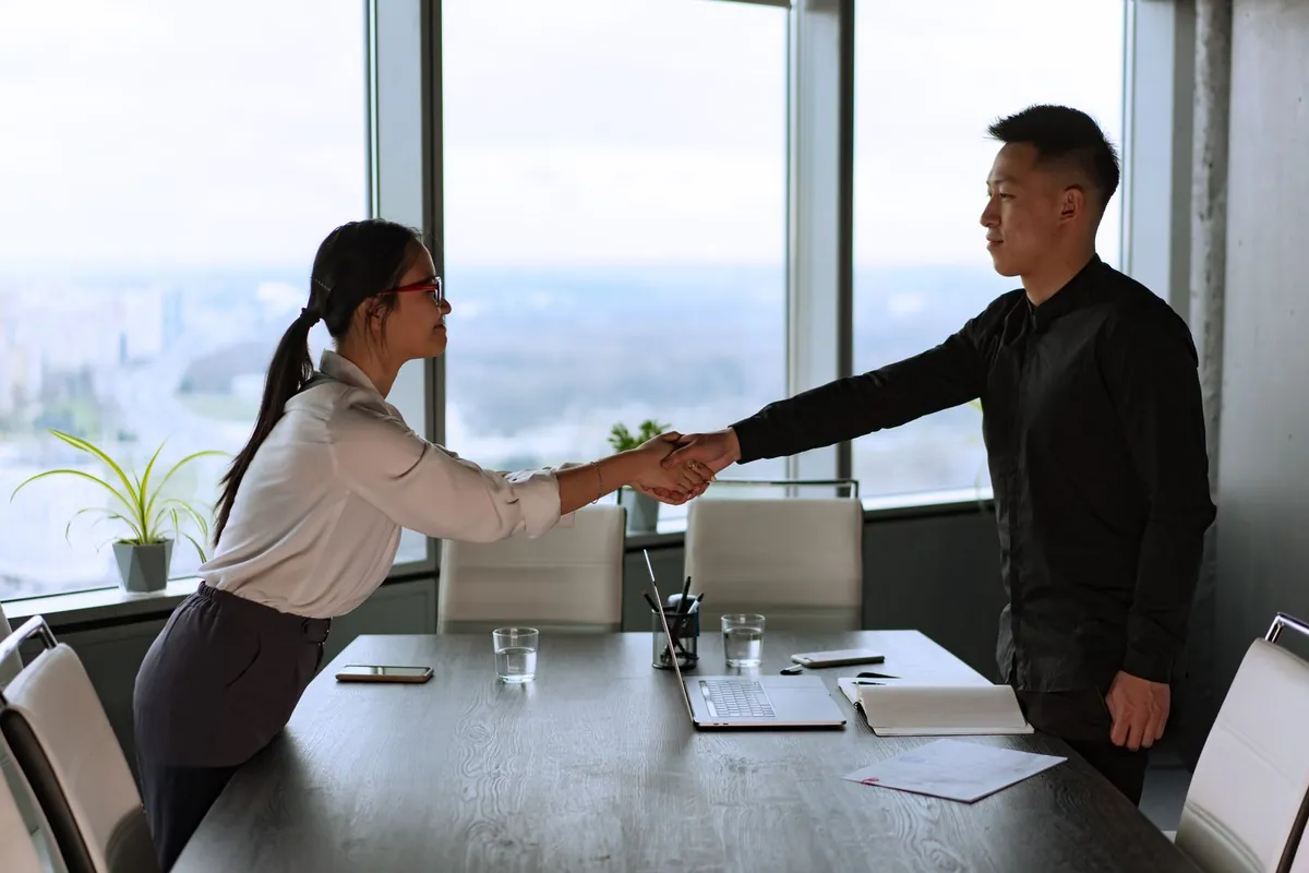 new employee first day at office handshake welcome