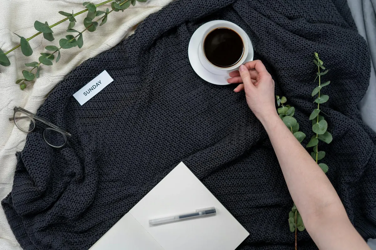 calm sunday morning planner notebook with coffee