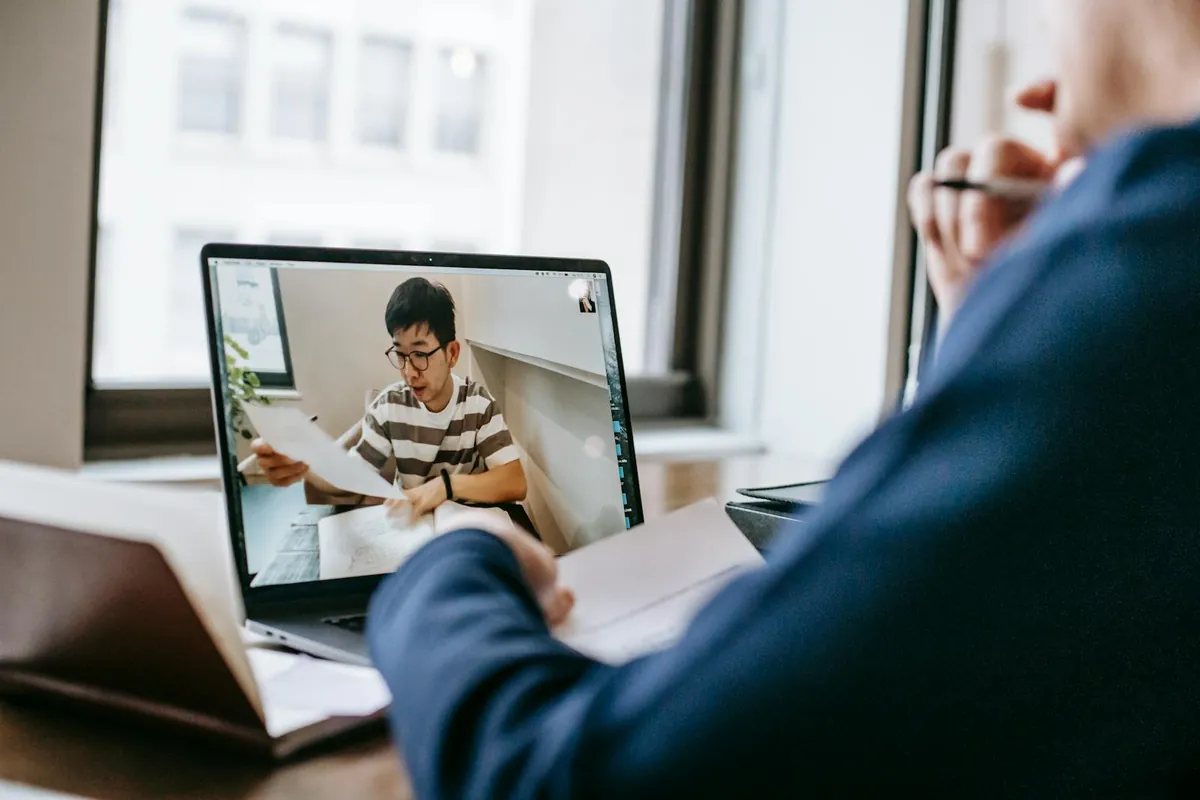 online MBA student laptop video class